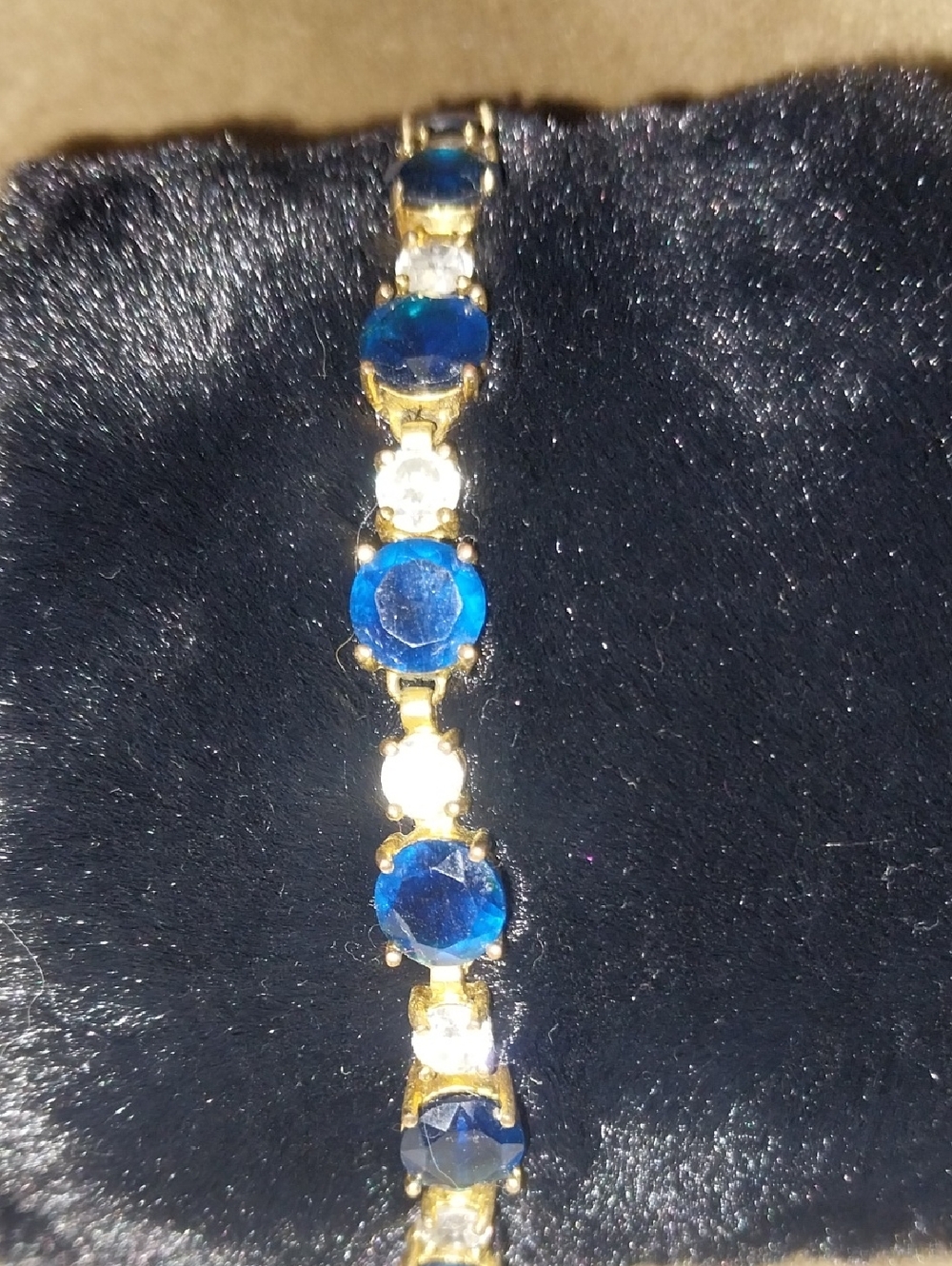 Gold tone Bracelet with Blue and Clear Stones